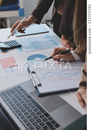 Accounting company provide finance and taxation planning for profitable cash flow, Auditor and accountant team working in office, analyze financial data and accounting record with calculator.Insight Accounting company provide finance and taxation planning for profitable cash flow, Auditor and accountant team working in office, analyze financial data and accounting record with calculator.Insight 123723391