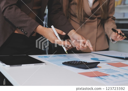 Accounting company provide finance and taxation planning for profitable cash flow, Auditor and accountant team working in office, analyze financial data and accounting record with calculator.Insight Accounting company provide finance and taxation planning for profitable cash flow, Auditor and accountant team working in office, analyze financial data and accounting record with calculator.Insight 123723392