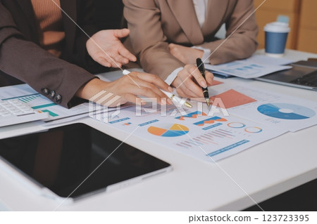 Accounting company provide finance and taxation planning for profitable cash flow, Auditor and accountant team working in office, analyze financial data and accounting record with calculator.Insight Accounting company provide finance and taxation planning for profitable cash flow, Auditor and accountant team working in office, analyze financial data and accounting record with calculator.Insight 123723395