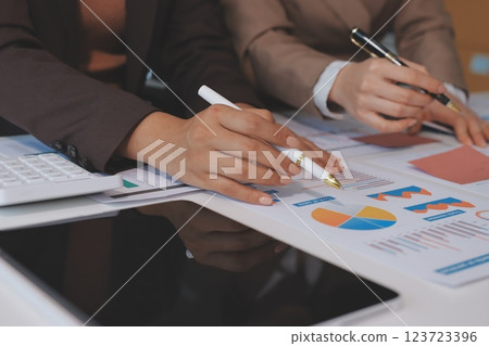 Accounting company provide finance and taxation planning for profitable cash flow, Auditor and accountant team working in office, analyze financial data and accounting record with calculator.Insight Accounting company provide finance and taxation planning for profitable cash flow, Auditor and accountant team working in office, analyze financial data and accounting record with calculator.Insight 123723396