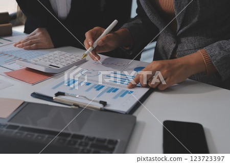 Accounting company provide finance and taxation planning for profitable cash flow, Auditor and accountant team working in office, analyze financial data and accounting record with calculator.Insight Accounting company provide finance and taxation planning for profitable cash flow, Auditor and accountant team working in office, analyze financial data and accounting record with calculator.Insight 123723397