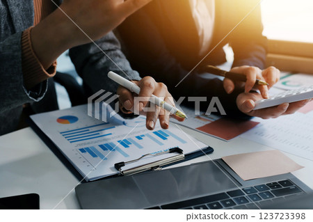 Accounting company provide finance and taxation planning for profitable cash flow, Auditor and accountant team working in office, analyze financial data and accounting record with calculator.Insight Accounting company provide finance and taxation planning for profitable cash flow, Auditor and accountant team working in office, analyze financial data and accounting record with calculator.Insight 123723398