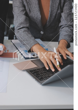Accounting company provide finance and taxation planning for profitable cash flow, Auditor and accountant team working in office, analyze financial data and accounting record with calculator.Insight 123723400