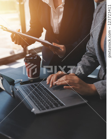 Accounting company provide finance and taxation planning for profitable cash flow, Auditor and accountant team working in office, analyze financial data and accounting record with calculator.Insight 123723411