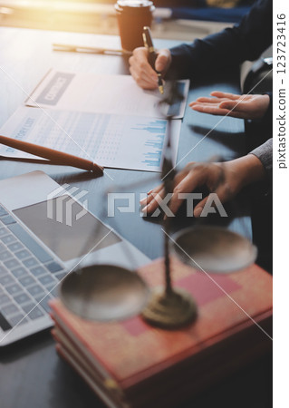 Judge gavel with Justice lawyers having team meeting at law firm background. Concepts of Law and Legal services. Judge gavel with Justice lawyers having team meeting at law firm background. Concepts of Law and Legal services. 123723416