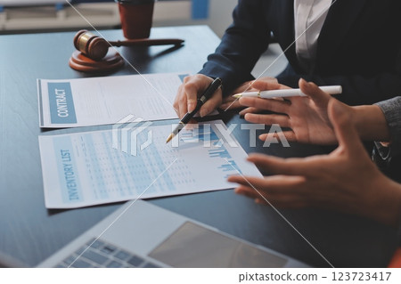 Judge gavel with Justice lawyers having team meeting at law firm background. Concepts of Law and Legal services. Judge gavel with Justice lawyers having team meeting at law firm background. Concepts of Law and Legal services. 123723417