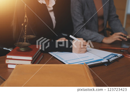Judge gavel with Justice lawyers having team meeting at law firm background. Concepts of Law and Legal services. Judge gavel with Justice lawyers having team meeting at law firm background. Concepts of Law and Legal services. 123723423