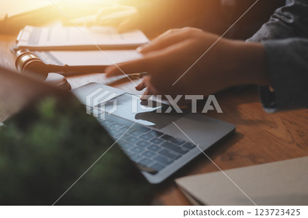 Judge gavel with Justice lawyers having team meeting at law firm background. Concepts of Law and Legal services. Judge gavel with Justice lawyers having team meeting at law firm background. Concepts of Law and Legal services. 123723425