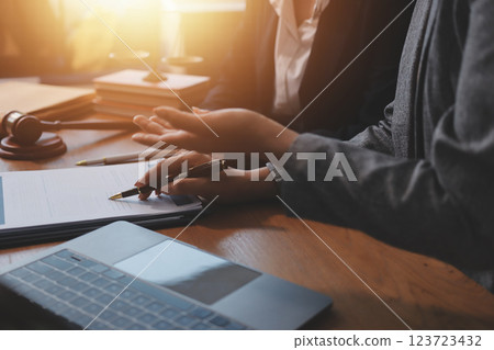 Judge gavel with Justice lawyers having team meeting at law firm background. Concepts of Law and Legal services. 123723432