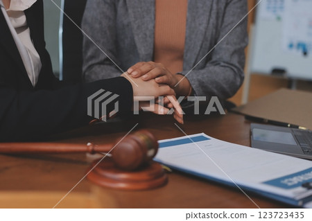 Judge gavel with Justice lawyers having team meeting at law firm background. Concepts of Law and Legal services. Judge gavel with Justice lawyers having team meeting at law firm background. Concepts of Law and Legal services. 123723435