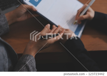 Judge gavel with Justice lawyers having team meeting at law firm background. Concepts of Law and Legal services. 123723442