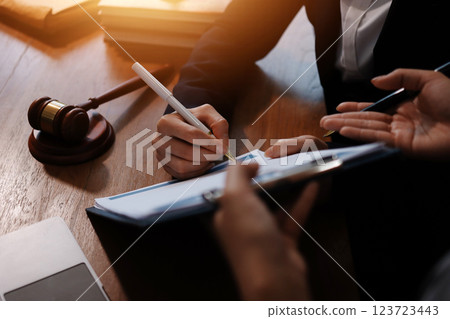 Judge gavel with Justice lawyers having team meeting at law firm background. Concepts of Law and Legal services. Judge gavel with Justice lawyers having team meeting at law firm background. Concepts of Law and Legal services. 123723443