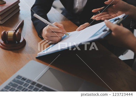 Judge gavel with Justice lawyers having team meeting at law firm background. Concepts of Law and Legal services. Judge gavel with Justice lawyers having team meeting at law firm background. Concepts of Law and Legal services. 123723444