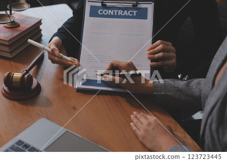 Judge gavel with Justice lawyers having team meeting at law firm background. Concepts of Law and Legal services. Judge gavel with Justice lawyers having team meeting at law firm background. Concepts of Law and Legal services. 123723445