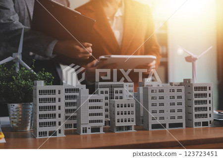Discussion among businesspeople on the latest developments in solar cell panel technology and Solar Energy Environment city Concept. Discussion among businesspeople on the latest developments in solar cell panel technology and Solar Energy Environment city Concept. 123723451