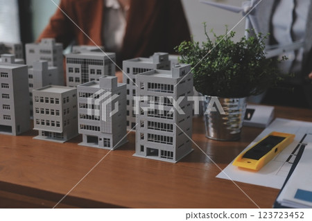 Discussion among businesspeople on the latest developments in solar cell panel technology and Solar Energy Environment city Concept. Discussion among businesspeople on the latest developments in solar cell panel technology and Solar Energy Environment city Concept. 123723452