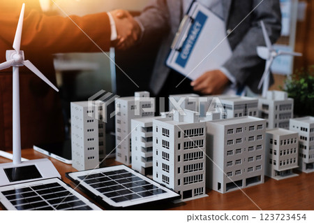 Discussion among businesspeople on the latest developments in solar cell panel technology and Solar Energy Environment city Concept. Discussion among businesspeople on the latest developments in solar cell panel technology and Solar Energy Environment city Concept. 123723454