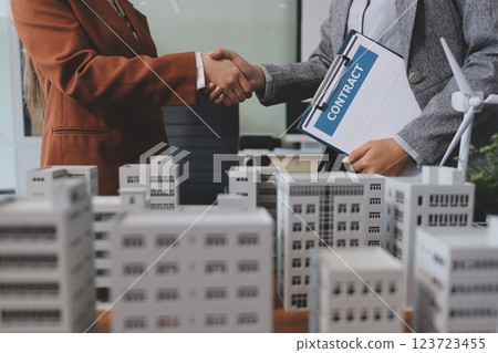 Discussion among businesspeople on the latest developments in solar cell panel technology and Solar Energy Environment city Concept. Discussion among businesspeople on the latest developments in solar cell panel technology and Solar Energy Environment city Concept. 123723455