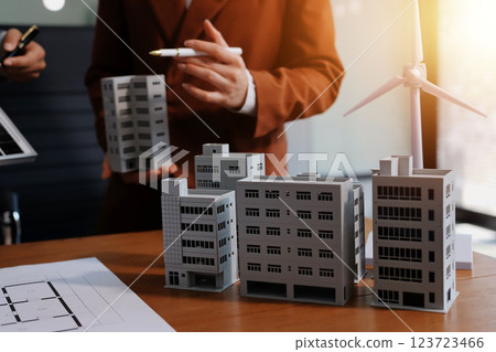 Discussion among businesspeople on the latest developments in solar cell panel technology and Solar Energy Environment city Concept. 123723466