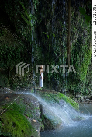 Woman Standing Under Antalya Duden Famous Waterfall in Green Paradise Woman Standing Under Antalya Duden Famous Waterfall in Green Paradise 123726088