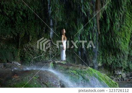 Woman Standing Under Antalya Duden Waterfall in Tranquil Nature Woman Standing Under Antalya Duden Waterfall in Tranquil Nature 123726112