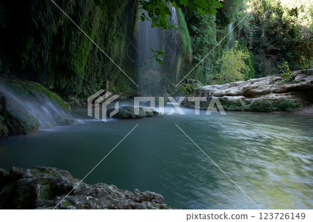 Antalya Famous Waterfall Flowing Into a Serene River  123726149