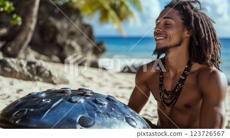 A man sits on a sandy beach playing a musical instrument with a smile on his face. Concept of relaxation and enjoyment. 123726567