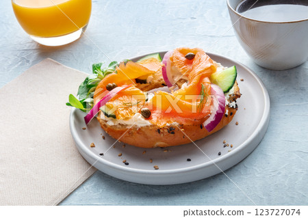 Lox bagel. A breakfast of a sandwich with smoked salmon and veggies 123727074