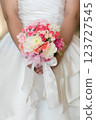 Bride holding bouquet handmade by her husband 123727545