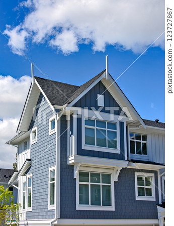 New residential townhouse on bright sunny day 123727867
