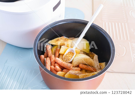 German potatoes made in a rice cooker - adding seasonings 123728042