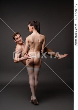 Beautiful couple sharing intimate connection in soft lighting moment 123728137