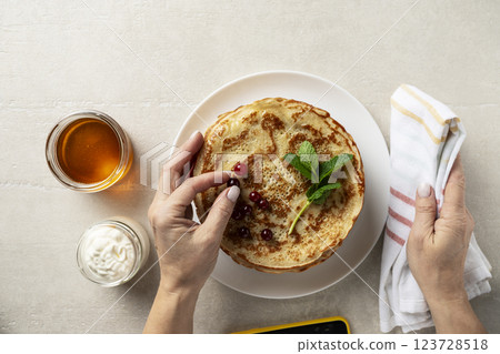 Large pancakes on light stone background 123728518