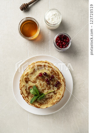 Large pancakes on light stone background 123728519