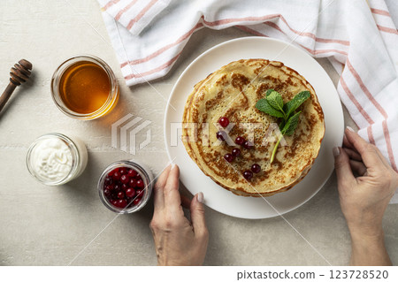 Large pancakes on light stone background 123728520