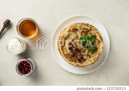 Large pancakes on light stone background 123728523