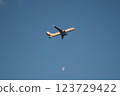 Airplane flying blue sky 123729422