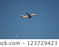 Airplane flying blue sky 123729423