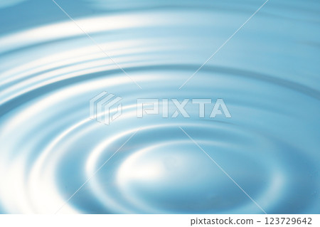 Ripples spreading on the water surface (background image) Ripples spreading on the water surface (background image) 123729642