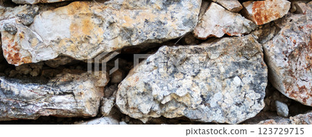 Wall stone foreground. Stacked natural stone background Wall stone foreground. Stacked natural stone background 123729715