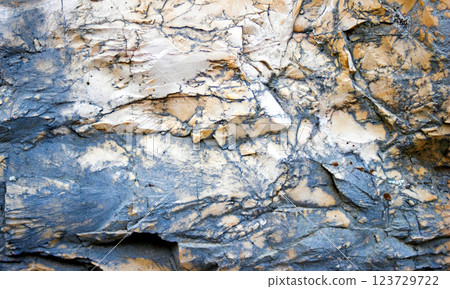 Stone wall texture. Close up. Natural stone background in beige and black tones. Stone wall texture. Close up. Natural stone background in beige and black tones. 123729722