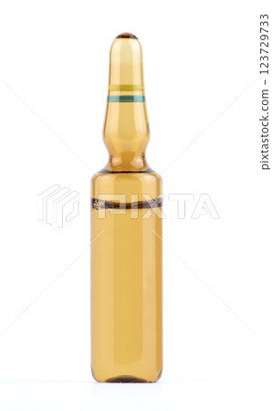 Clear brown glass ampoule filled with liquid medicine. High quality photo 123729733