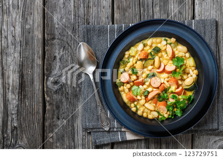 white bean chickpea chili with sausages, zucchini white bean chickpea chili with sausages, zucchini 123729751