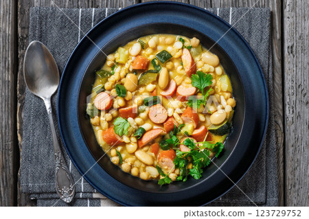 white bean chickpea chili with sausages, zucchini white bean chickpea chili with sausages, zucchini 123729752