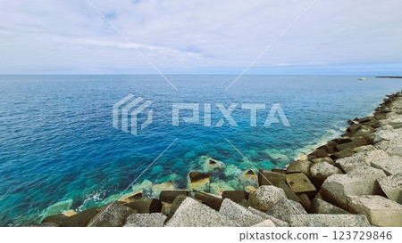 Blue ocean and grey rocks 123729846