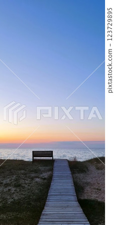Wooden road to the sea beach with one bench Wooden road to the sea beach with one bench 123729895