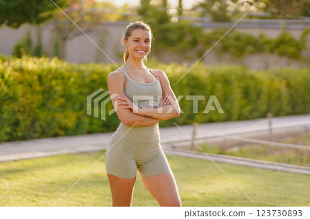 A Confident Fitness Model is Posing Outdoors in Stylish and Comfortable Activewear Attire 123730893