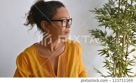 Woman Working Remotely in a Comfortable Home with Natural Plants 123731169