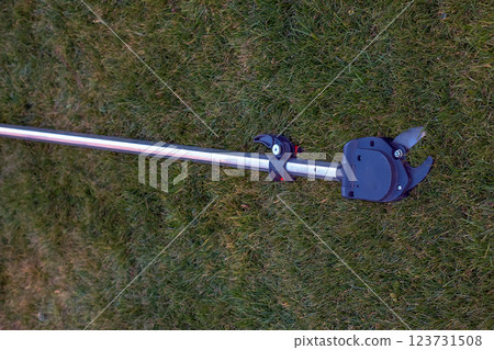 Garden pruner for high-altitude work. Close-up 123731508