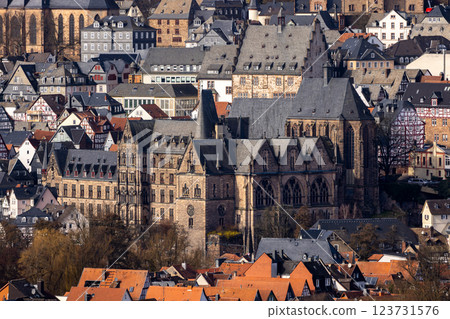 The old University's church and behind it the town hall in the old town of Marburg, Hesse, Germany, Europe The old University's church and behind it the town hall in the old town of Marburg, Hesse, Germany, Europe 123731576